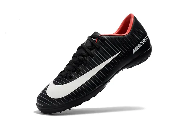 Nike Chaussures de football indoor orange noir silhouette basse ribbelée tige synthétique 16