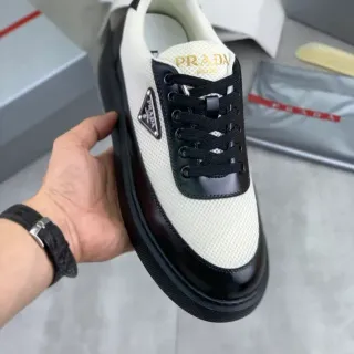 Prada White Black Mesh And Patent Leather Paneling Triangular Metal Logo Plaque Lifestyle Sneakers