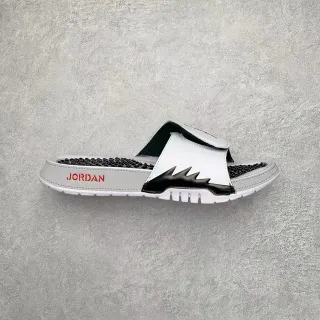 Chanclas slide Air Jordan de una sola tira en blanco y negro con plantilla texturizada