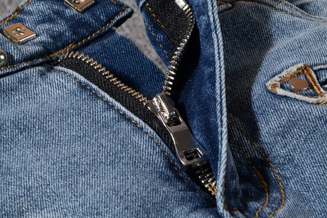 Balmain Studded Distressed Light-Wash Jeans 12