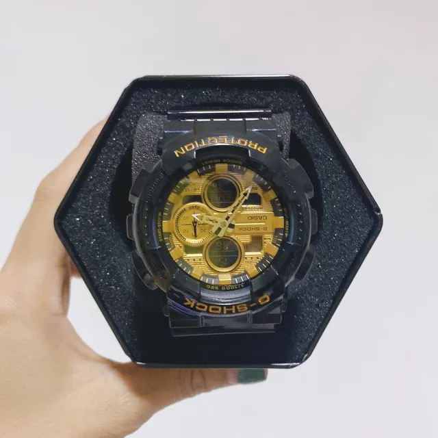 Casio G-Shock GA-100 काली और सोने की खेल घड़ी 4