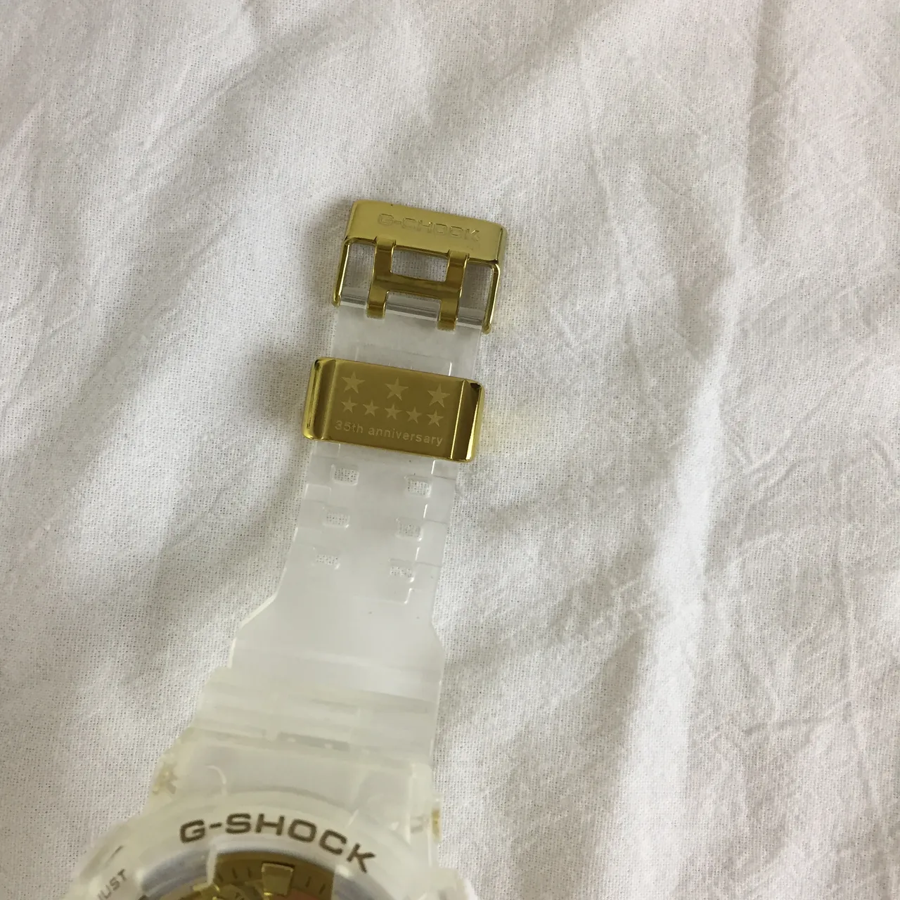 Casio G-Shock GA-100 अर्ध-पारदर्शी सफेद और सोने का स्पोर्ट्स वॉच 4