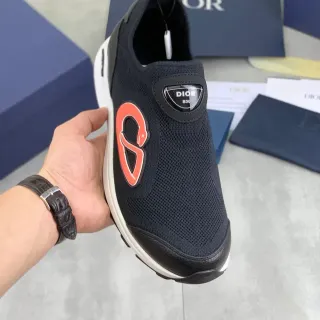 Dior B30 काली और नारंगी स्लिप-ऑन लाइफस्टाइल स्नीकर