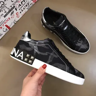 Dolce & Gabbana Portofino حذاء أسلوب حياة أسود أبيض كامو برنت علوي مدبب جانبي لوجو