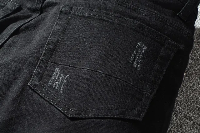 Jeans noirs distressed avec patchwork et rivets 4