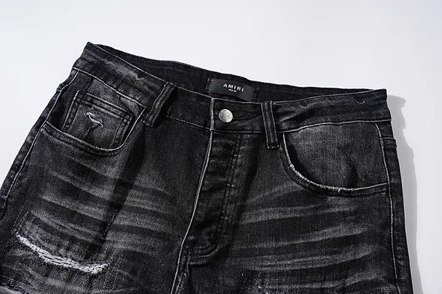 Jeans noirs déchirés brodés avec monogramme 4
