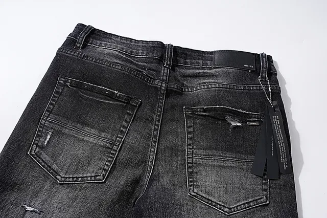 Jeans noirs déchirés brodés avec monogramme 5