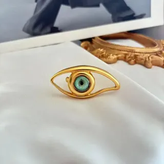 Gold-Toned Eye-Shaped Green Iris Brooch — catalogue photo via WWTop Yupoo