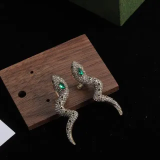 Brincos em forma de serpente Pavé de cristal e esmeralda