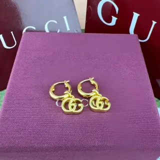 أقراط جوتشي Double G Hoop ذهبي اللون Interlocking Logo