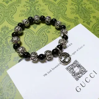 سوار Gucci GG Marmont أسود وفضي بحبات