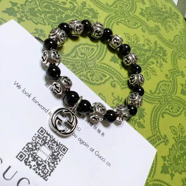 سوار Gucci GG Marmont أسود وفضي بحبات 3