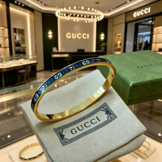 Gucci GG Marmont سوارة إكليل أزرق وذهبي مفصلي