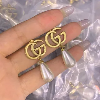 Gucci GG Marmont أقراط قطرة معلقة ذهبية اللون مزدوجة G
