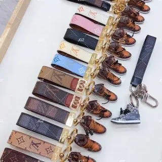Louis Vuitton Brown Beige Monogrammed Leather Strap Miniature High-Top Sneaker Charm Crossbody Bag