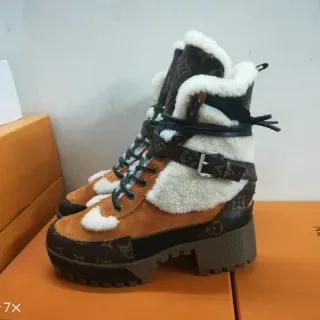 Louis Vuitton বাদামী কালো মোনোগ্রাম ক্যানভাস শিয়ারলিং-লাইন্ড স্নো বুটস