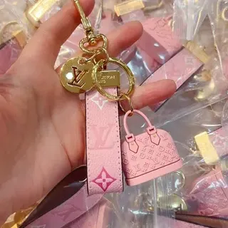 Louis Vuitton Sac à main en cuir avec ferrures rose doré monogrammé