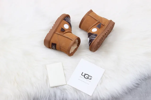 UGG क्लासिक मिनी कैट फेस ब्राउन स्नो बूट्स 3