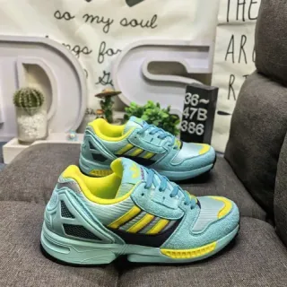 Adidas حذاء رياضي أسلوب حياة أزرق أصفر مع upper من الشبيكة المتعددة الطبقات والمخمل، overlay من إطار TPU