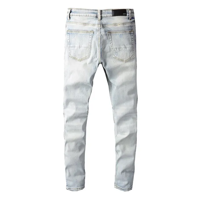 Amiri Calças Jeans Azuis e Brancas Desgastadas com Estampa Gráfica 11