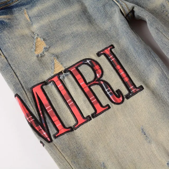Amiri Pantalones Vaqueros Slim-Fit con Logo Distressed 12