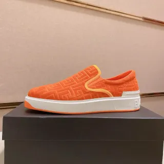 Balenciaga Speed Trainer नारंगी एंबॉस्ड मोनोग्राम स्लिप-ऑन लाइफस्टाइल स्नीकर