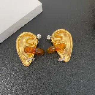 Pendientes de metal dorados transparentes en forma de oreja escultórica