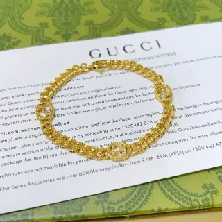 سوار Gucci GG Marmont ذهبي سلسلة كرب لينك سميكة مع medallions شعار G متشابك
