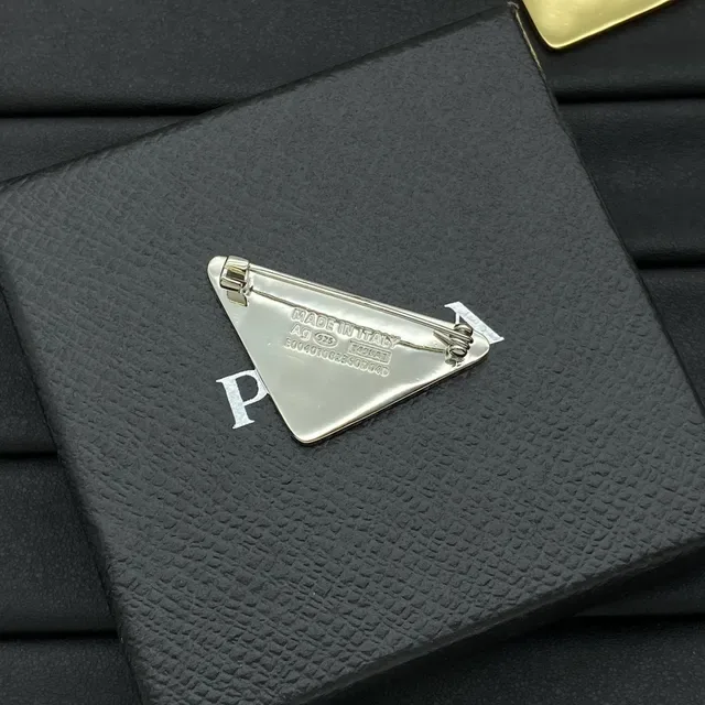 Prada Triangle Logo Brooch Black and White Enamel Gold Silver Trim Brooches 4