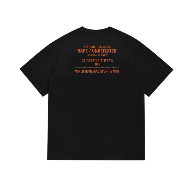 A Bathing Ape BAPE x UNDEFEATED T-shirt camouflage à imprimé graphique noir et orange 5