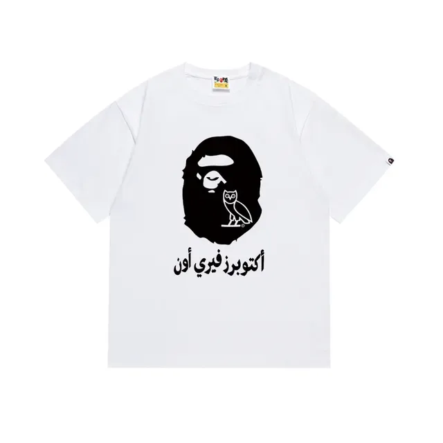 Camiseta gráfica A Bathing Ape x OVO com cabeça de macaco e coruja dourada 5
