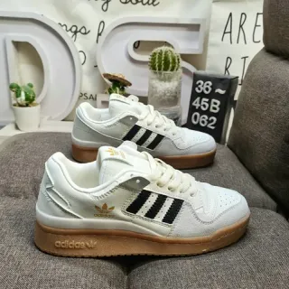 Adidas أبيض وأسود لوتوب جوم سول نمط حياة سنيكرز