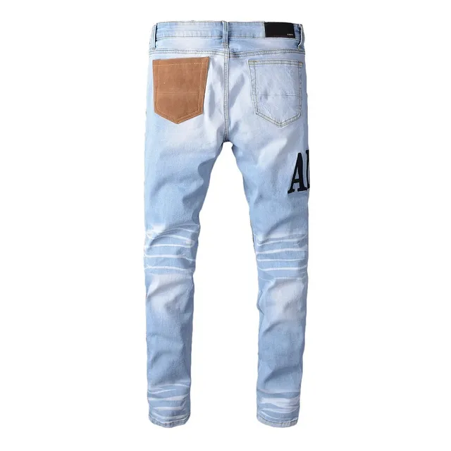 Amiri Jeans con Patchwork Distressed Logo 2