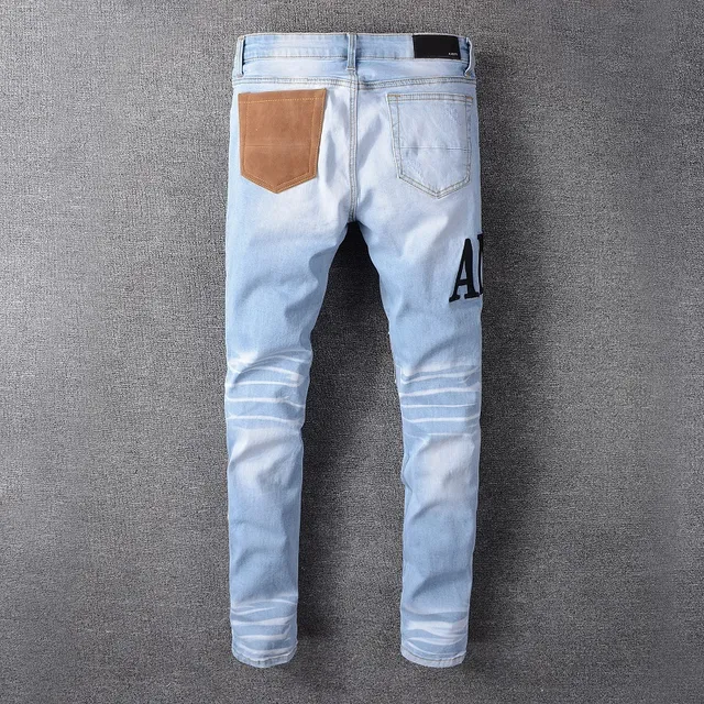 Amiri Jeans con Patchwork Distressed Logo 3