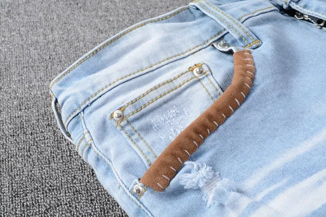Amiri Jeans con Patchwork Distressed Logo 5