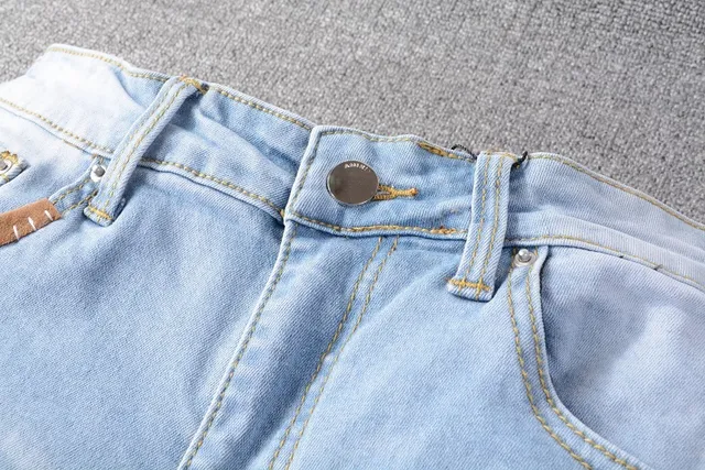 Amiri Jeans con Patchwork Distressed Logo 9