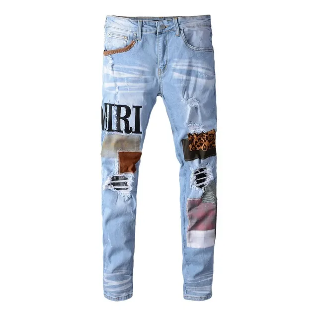 Amiri Jeans con Patchwork Distressed Logo 11