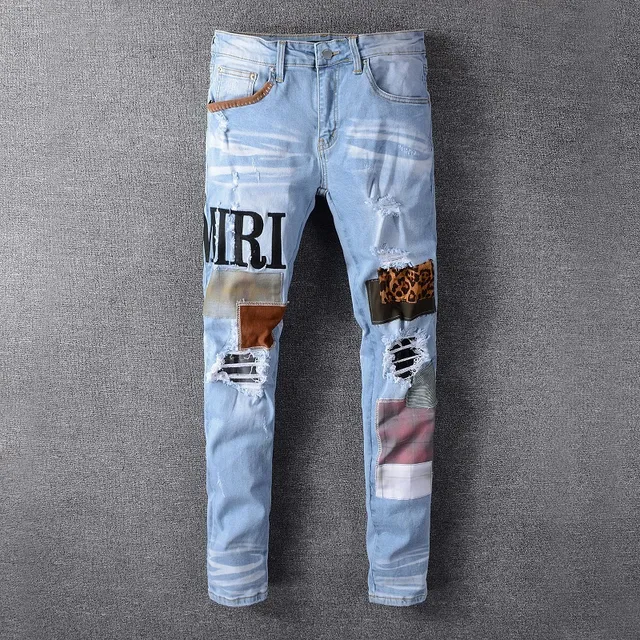 Amiri Jeans con Patchwork Distressed Logo 12