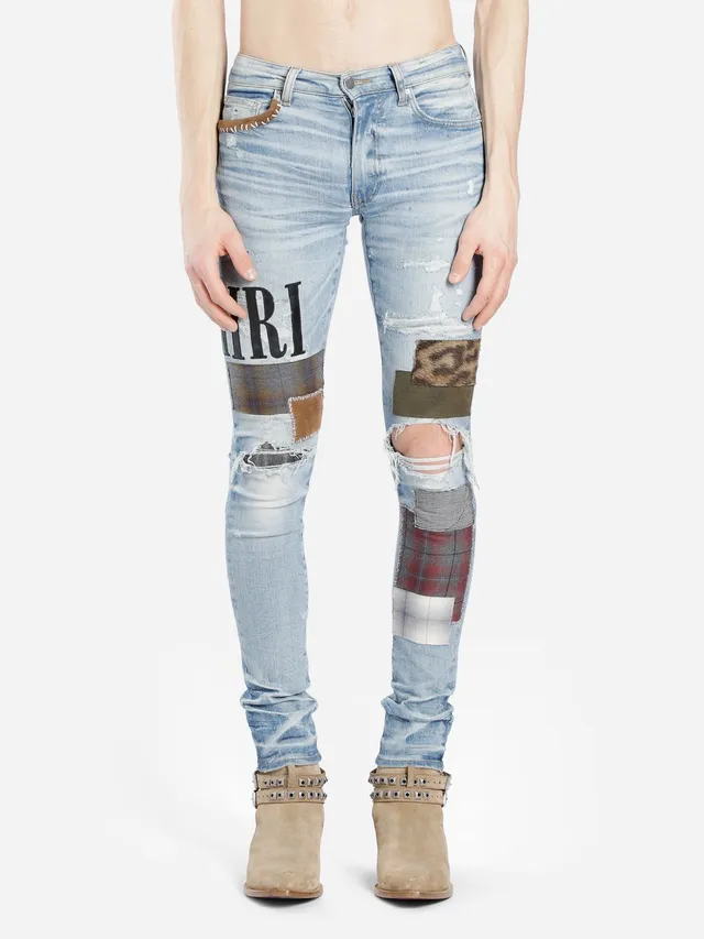 Amiri Jeans con Patchwork Distressed Logo 14