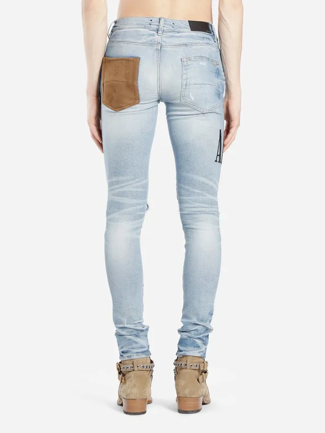Amiri Jeans con Patchwork Distressed Logo 15