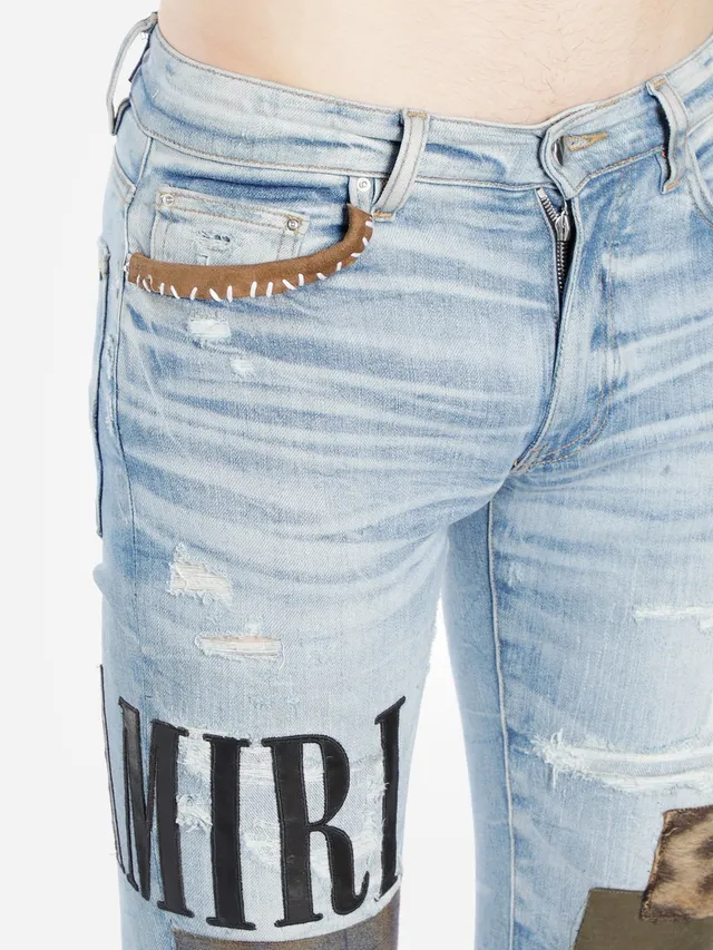 Amiri Jeans con Patchwork Distressed Logo 17