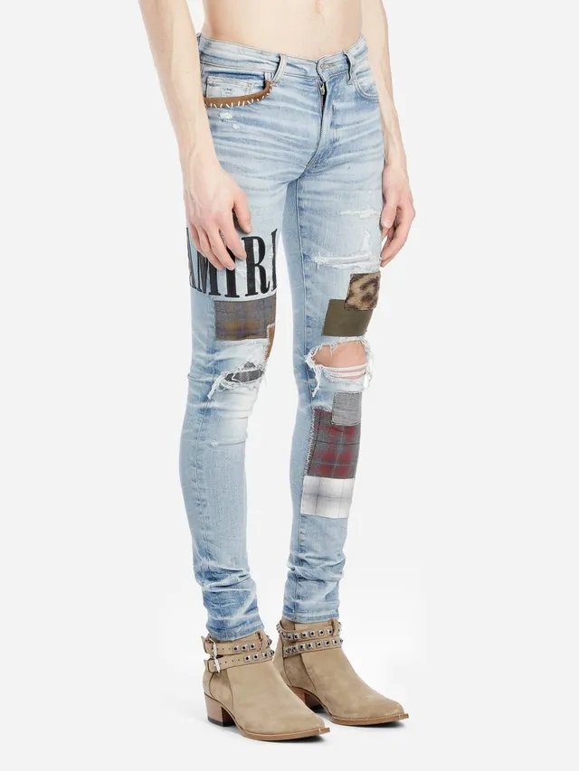 Amiri Jeans con Patchwork Distressed Logo 18