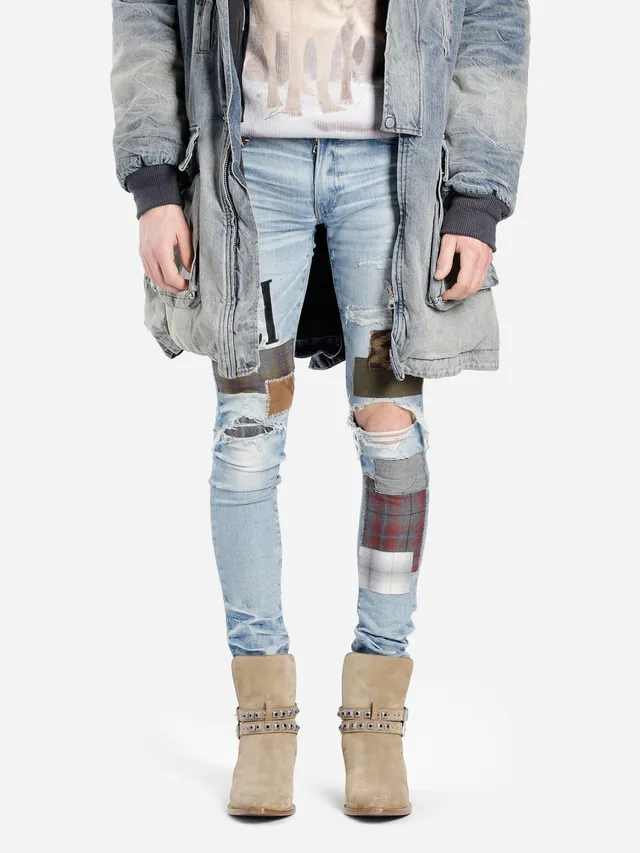 Amiri Jeans con Patchwork Distressed Logo 19