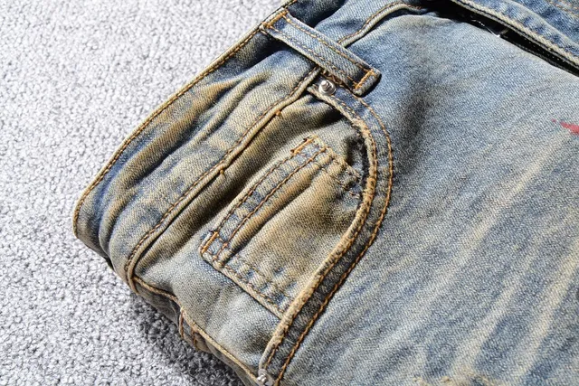 Jean bleu slim-fit distressed avec éclaboussures de peinture 9