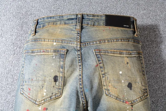 Jean bleu slim-fit distressed avec éclaboussures de peinture 12