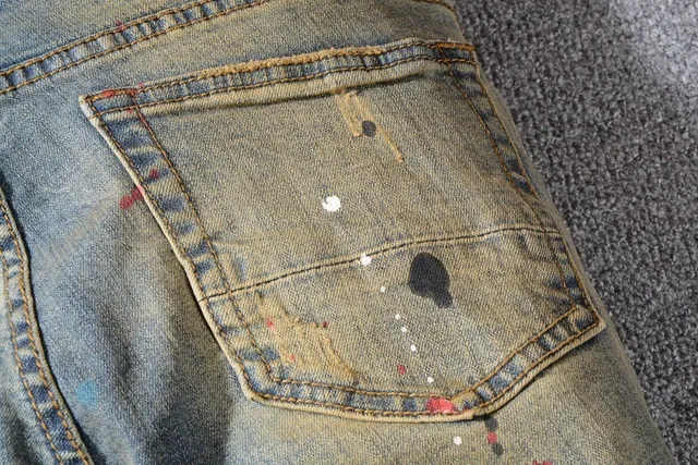Jean bleu slim-fit distressed avec éclaboussures de peinture 13