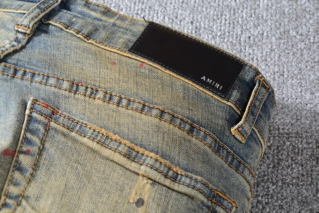 Jean bleu slim-fit distressed avec éclaboussures de peinture 14