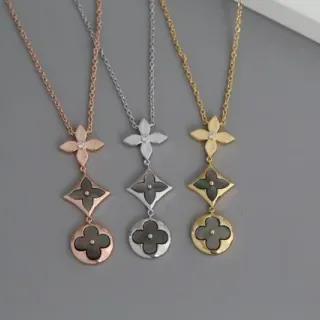 Collier pendentif or et argent motifs de quatrefoil multi-niveaux