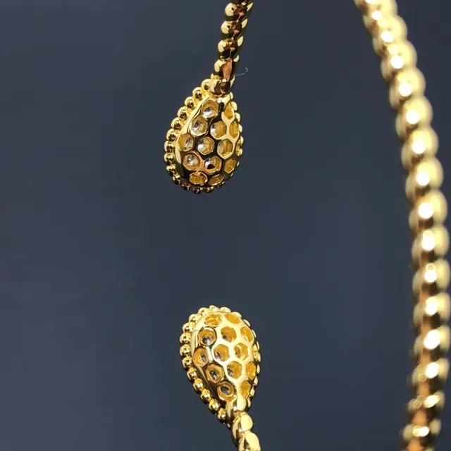 Anneau argent et or tête de larme pavé bande style corde enroulée 3