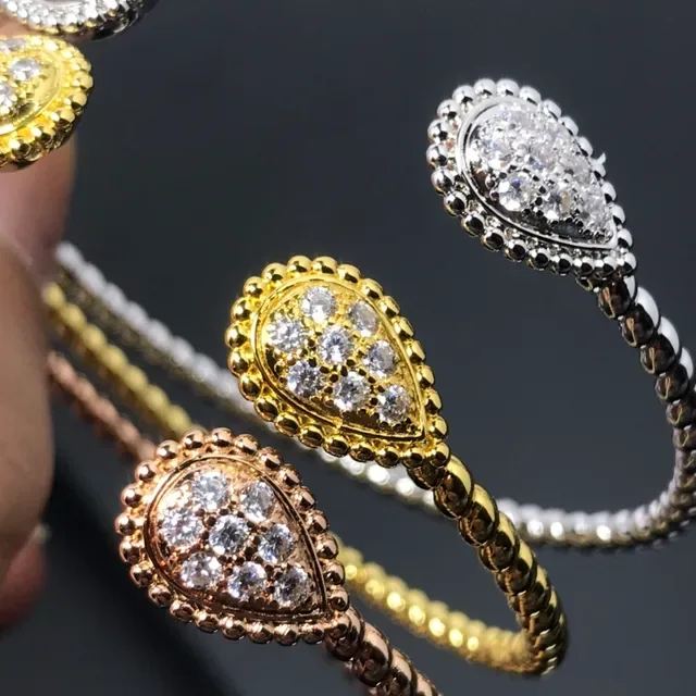 Anneau argent et or tête de larme pavé bande style corde enroulée 4
